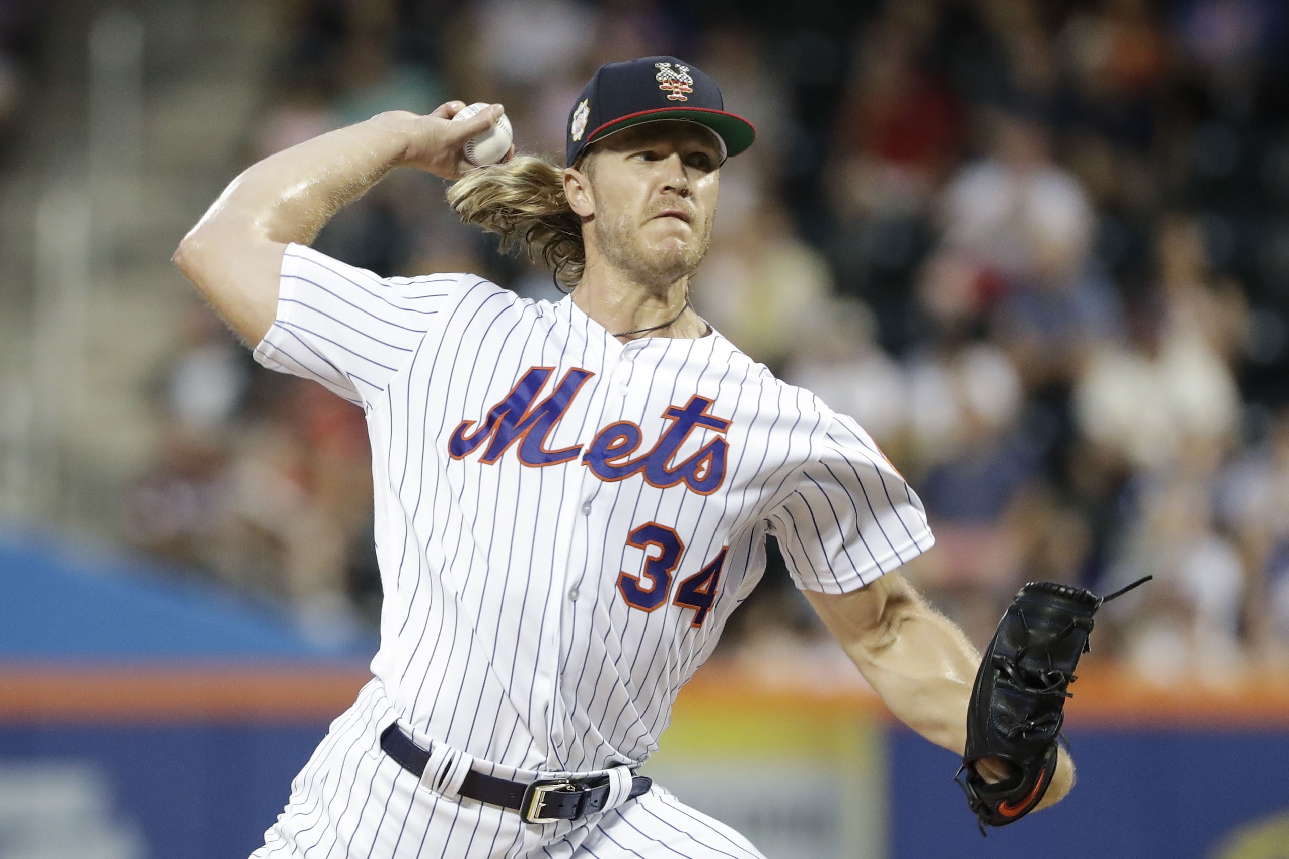New York Mets' Noah Syndergaard delivers a pitch during the first inning of a baseball game against the Philadelphia Phillies Saturday, July 6, 2019, in New York. (AP Photo/Frank Franklin II)