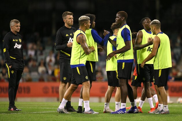 PERTH, AUSTRALIA - JULY 11: Players acknowledge each other at the conclusion of the session as Ole Gunnar Solskjaer looks on during a Manchester United training session at the WACA on July 11, 2019 in Perth, Australia. (Photo by Paul Kane/Getty Images)