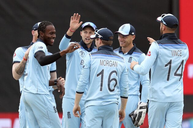 England's bowler Jofra Archer, left, celebrates with teammates after taking a wicket of Australia's Glenn Maxwell during the Cricket World Cup semi-final match between Australia and England at Edgbaston in Birmingham, England, Thursday, July 11, 2019. (AP Photo/Rui Vieira)