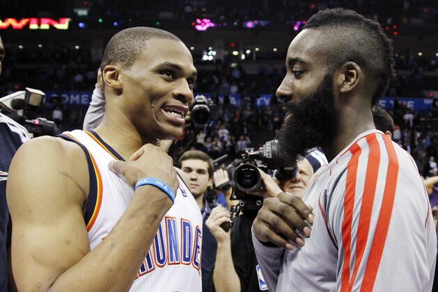 Oklahoma City Thunder guard Russell Westbrook (0) and Houston Rockets guard James Harden, right, talk after their NBA basketball game in Oklahoma City, Wednesday, Nov. 28, 2012. Oklahoma City won 120-98. (AP Photo/Sue Ogrocki)