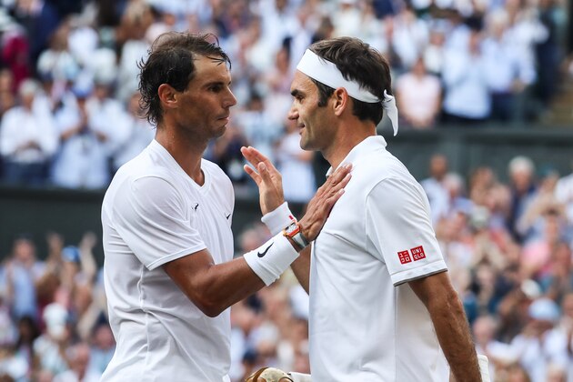 LONDON, ENGLAND - JULY 12: Roger Federer (R) of Switzerland greets Rafael Nadal of Spain after their Men's Singles semi-final match during Day eleven of The Championships - Wimbledon 2019 at All England Lawn Tennis and Croquet Club on July 12, 2019 in London, England. (Photo by Shi Tang/Getty Images)