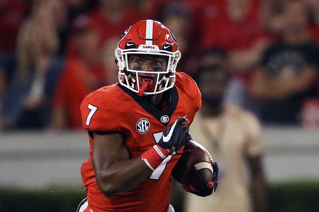FILE - In this Oct. 14, 2017, file photo, Georgia running back D'Andre Swift (7) runs against Missouri in the second half of an NCAA college football game in Athens, Ga. While playing behind seniors Nick Chubb and Sony Michel, Swift was Georgia’s third-leading rusher with 618 yards and fourth on the team with 17 catches (more than Chubb and Michel combined) for 153 yards. (AP Photo/John Bazemore, File)