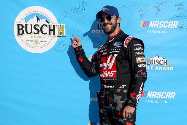 SPARTA, KENTUCKY - JULY 12: Daniel Suarez, driver of the #41 Haas Automation Ford, celebrates with the Busch Pole Award after qualifying for the Monster Energy NASCAR Cup Series Quaker State 400 Presented by Walmart at Kentucky Speedway on July 12, 2019 in Sparta, Kentucky. (Photo by Brian Lawdermilk/Getty Images)
