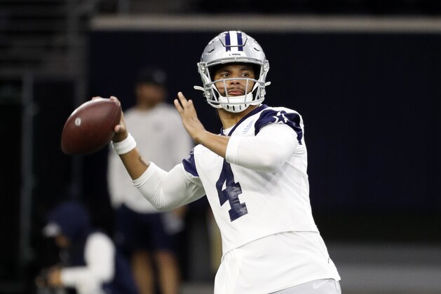 Dallas Cowboys quarterback Dak Prescott (4) drops back to pass during drills at the team's NFL football training facility in Frisco, Texas, Tuesday, June 11, 2019. (AP Photo/Tony Gutierrez