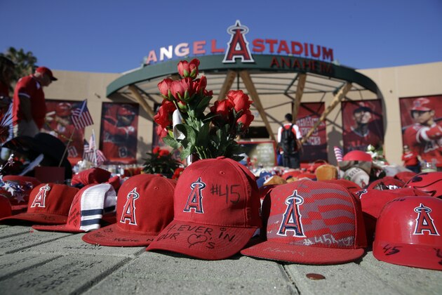 A makeshift shrine in honor of Los Angeles Angels pitcher Tyler Skaggs stands outside Angel Stadium before the team's baseball game against the Seattle Mariners on Friday, July 12, 2019, in Anaheim, Calif. (AP Photo/Marcio Jose Sanchez)