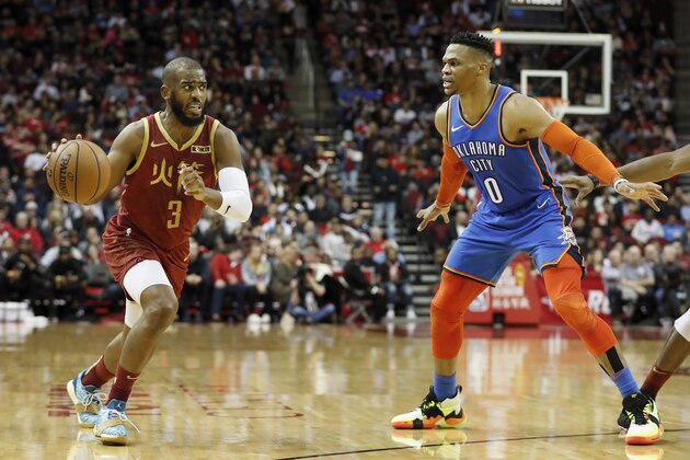 HOUSTON, TX - FEBRUARY 09:  Chris Paul #3 of the Houston Rockets drives to the basket defended by Russell Westbrook #0 of the Oklahoma City Thunder in the first half at Toyota Center on February 9, 2019 in Houston, Texas.  NOTE TO USER: User expressly acknowledges and agrees that, by downloading and or using this photograph, User is consenting to the terms and conditions of the Getty Images License Agreement.  (Photo by Tim Warner/Getty Images)
