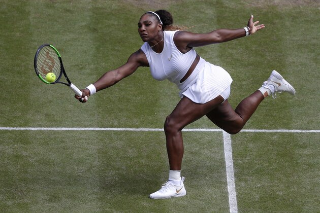 United States' Serena Williams returns to Czech Republic's Barbora Strycova during a women's singles semifinal match on day ten of the Wimbledon Tennis Championships in London, Thursday, July 11, 2019. (AP Photo/Alastair Grant)