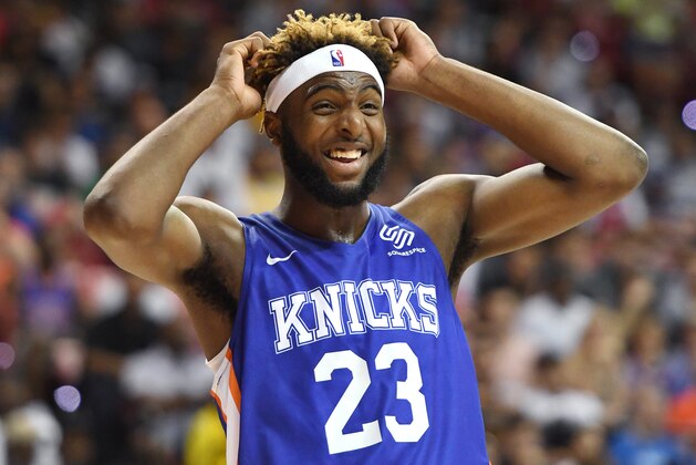 LAS VEGAS, NEVADA - JULY 07:  Mitchell Robinson #23 of the New York Knicks reacts on the court during a game against the Phoenix Suns during the 2019 NBA Summer League at the Thomas & Mack Center on July 7, 2019 in Las Vegas, Nevada. NOTE TO USER: User expressly acknowledges and agrees that, by downloading and or using this photograph, User is consenting to the terms and conditions of the Getty Images License Agreement.  (Photo by Ethan Miller/Getty Images)