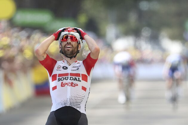 Belgium's Thomas de Gendt celebrates as he crosses the finish line to win the eighth stage of the Tour de France cycling race over 200 kilometers (125 miles) with start in Macon and finish in Saint Etienne, France, Saturday, July 13, 2019. (AP Photo/Thibault Camus)