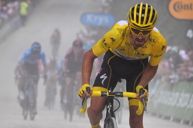 France's Julian Alaphilippe, wearing the overall leader's yellow jersey, and cyclists ride in the last kilometre of the sixth stage of the 106th edition of the Tour de France cycling race between Mulhouse and La Planche des Belles Filles, in La Planche des Belles Filles on July 11, 2019. (Photo by BERNARD PAPON / POOL / AFP)        (Photo credit should read BERNARD PAPON/AFP/Getty Images)