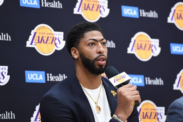 EL SEGUNDO, CA - JULY 13 :  Anthony Davis #3 of the Los Angeles Lakers speaks with the media as General Manager Rob Pelinka and Head Coach Frank Vogel  introduce him to the Los Angeles Lakers during a press conference on July 13, 2019 at the UCLA Health Training Center in El Segundo, California. NOTE TO USER: User expressly acknowledges and agrees that, by downloading and/or using this photograph, user is consenting to the terms and conditions of the Getty Images License Agreement. Mandatory Copyright Notice: Copyright 2019 NBAE (Photo by Juan Ocampo/NBAE via Getty Images)