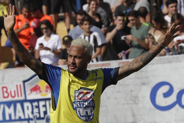 Brazilian soccer player Neymar acknowledges fans during the Neymar Jr's Five youth soccer tournament in Praia Grande, Brazil, Saturday, July 13, 2019. (AP Photo/Andre Penner)
