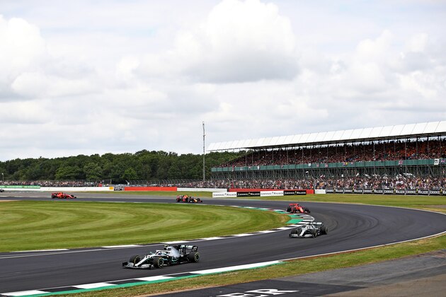 NORTHAMPTON, ENGLAND - JULY 14: Valtteri Bottas driving the (77) Mercedes AMG Petronas F1 Team Mercedes W10 leads Lewis Hamilton of Great Britain driving the (44) Mercedes AMG Petronas F1 Team Mercedes W10 on track during the F1 Grand Prix of Great Britain at Silverstone on July 14, 2019 in Northampton, England. (Photo by Bryn Lennon/Getty Images)