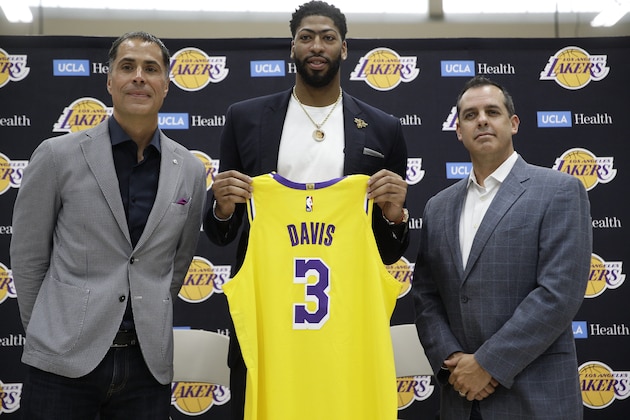 Los Angeles Lakers NBA basketball team general manager Rob Pelinka, left, and Head Coach Frank Vogel, right, introduce Anthony Davis at a news conference at the UCLA Health Training Center in El Segundo, Calif., Saturday, July 13, 2019 (AP Photo/Damian Dovarganes)