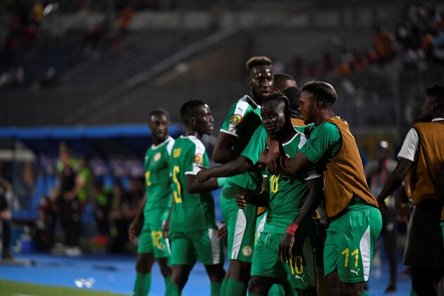Senegalese players celebrate after scoring a goal during the 2019 Africa Cup of Nations (CAN) Semi-final football match between Senegal and Tunisia at the 30 June stadium in Cairo on July 14, 2019. (Photo by Khaled DESOUKI / AFP)        (Photo credit should read KHALED DESOUKI/AFP/Getty Images)