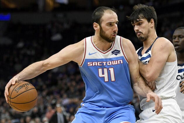 Minnesota Timberwolves forward Dario Saric (36), of Croatia, guards against Sacramento Kings center Kosta Koufos (41) during the fourth quarter of an NBA basketball game on Monday, Dec. 17, 2018, in Minneapolis. The Timberwolves won 132-105. (AP Photo/Hannah Foslien)