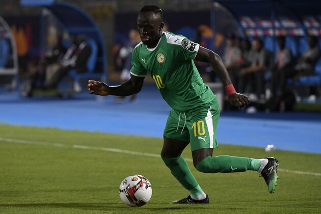 Senegal's forward Sadio Mane drives the ball during the 2019 Africa Cup of Nations (CAN) Semi-final football match between Senegal and Tunisia at the 30 June stadium in Cairo on July 14, 2019. (Photo by Khaled DESOUKI / AFP)        (Photo credit should read KHALED DESOUKI/AFP/Getty Images)