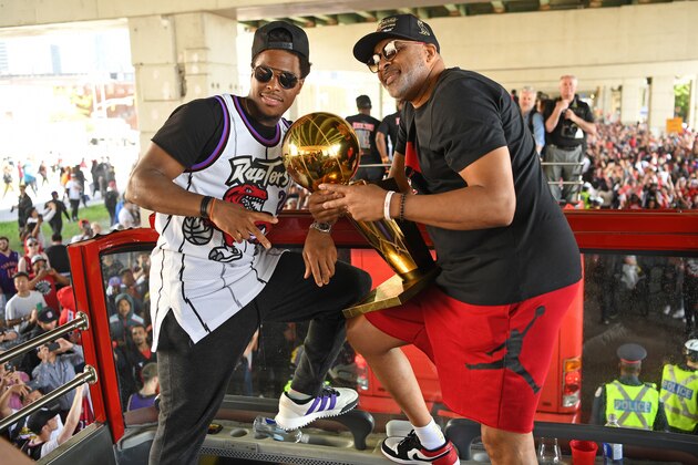 TORONTO, ON - JUNE 17: Kyle Lowry #7 and Assistant Coach Phil Handy of the Toronto Raptors pose for a photo with the Larry O'Brien Larry O'Brien Championship Trophy during the Toronto Raptors Championship Victory Parade on June 17, 2019 in Toronto, Ontario. NOTE TO USER: User expressly acknowledges and agrees that, by downloading and/or using this photograph, user is consenting to the terms and conditions of Getty Images License Agreement. Mandatory Copyright Notice: Copyright 2019 NBAE (Photo by Ron Turenne/NBAE via Getty Images)