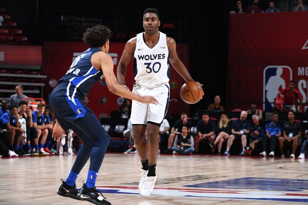 LAS VEGAS, NV - JULY 13: Kelan Martin #30 of the Minnesotta Timberwolves handles the ball against the Dallas Mavericks during Day 9 of the 2019 Las Vegas Summer League on July 13, 2019 at the Thomas & Mack Center in Las Vegas, Nevada NOTE TO USER: User expressly acknowledges and agrees that, by downloading and/or using this Photograph, user is consenting to the terms and conditions of the Getty Images License Agreement. Mandatory Copyright Notice: Copyright 2019 NBAE (Photo by Garrett Ellwood/NBAE via Getty Images)