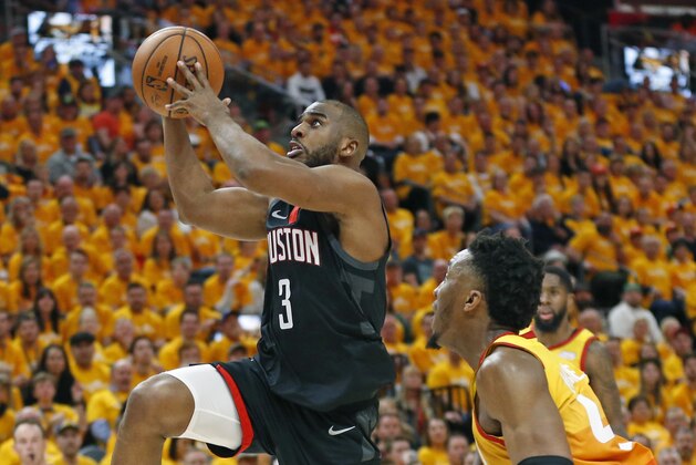 Houston Rockets guard Chris Paul (3) goes to the basket as Utah Jazz guard Donovan Mitchell, right, defends in the first half during an NBA basketball game Saturday, April 20, 2019, in Salt Lake City. (AP Photo/Rick Bowmer)