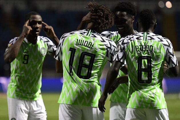 Nigeria's forward Alex Iwobi (C) celebrates his goal with teammates during the 2019 Africa Cup of Nations (CAN) Round of 16 football match between Nigeria and Cameroon at the Alexandria Stadium in the Egyptian city on July 6, 2019. (Photo by JAVIER SORIANO / AFP)        (Photo credit should read JAVIER SORIANO/AFP/Getty Images)