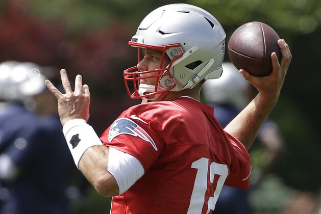 New England Patriots quarterback Tom Brady winds up for a pass during an NFL football training camp, Thursday, June 6, 2019, in Foxborough, Mass. (AP Photo/Steven Senne)