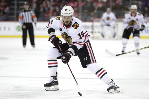 Chicago Blackhawks center Artem Anisimov, of Russia, in action against the New Jersey Devils during the first period of an NHL hockey game, Monday, Jan. 14, 2019, in Newark, N.J. (AP Photo/Julio Cortez)