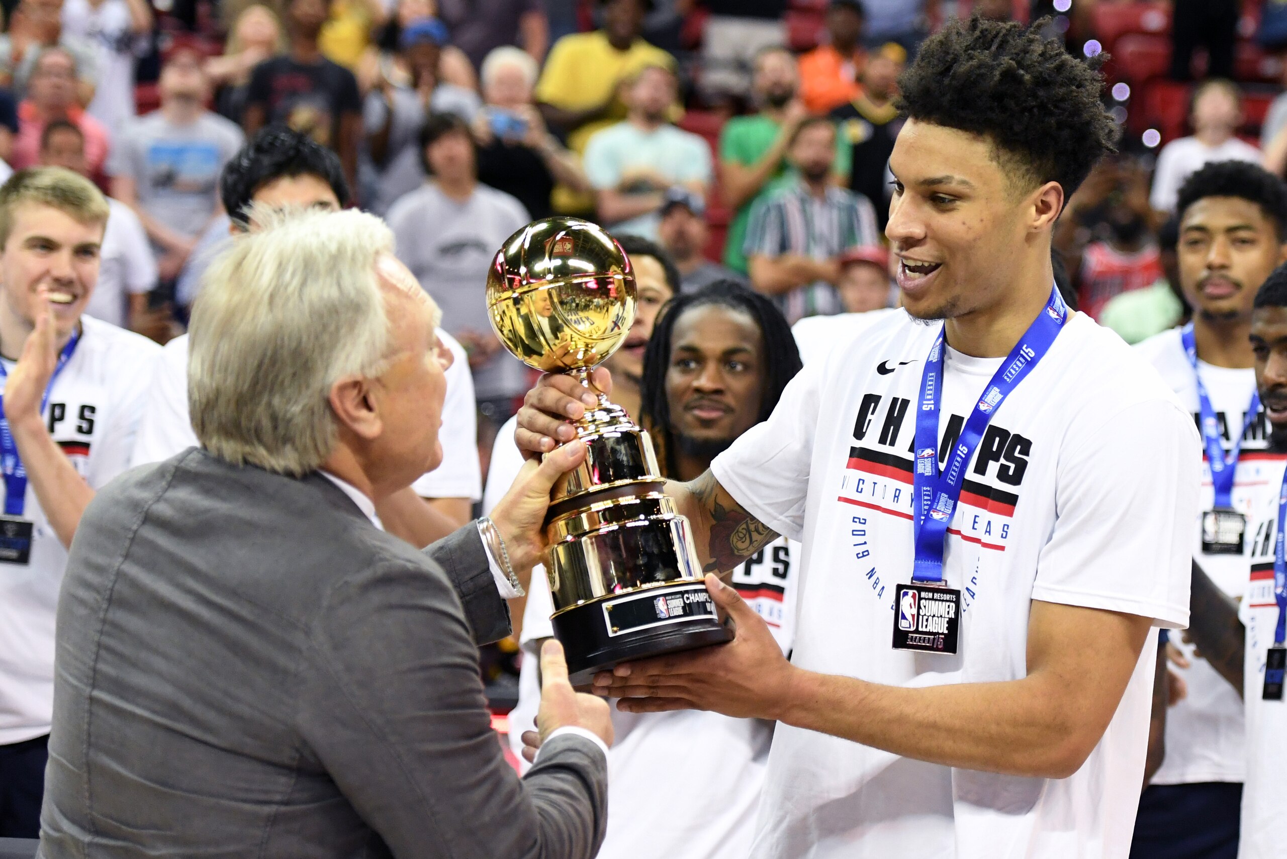 LAS VEGAS, NEVADA - JULY 15:  NBA Summer League co-founder Warren LeGarie (L) presents Brandon Clarke #15 of the Memphis Grizzlies with the championship game MVP trophy after the team's 95-92 victory over the Minnesota Timberwolves to win the championship game of the 2019 NBA Summer League at the Thomas & Mack Center on July 15, 2019 in Las Vegas, Nevada. Clarke was also awarded the 2019 NBA Las Vegas Summer League MVP trophy before the game. NOTE TO USER: User expressly acknowledges and agrees that, by downloading and or using this photograph, User is consenting to the terms and conditions of the Getty Images License Agreement.  (Photo by Ethan Miller/Getty Images)