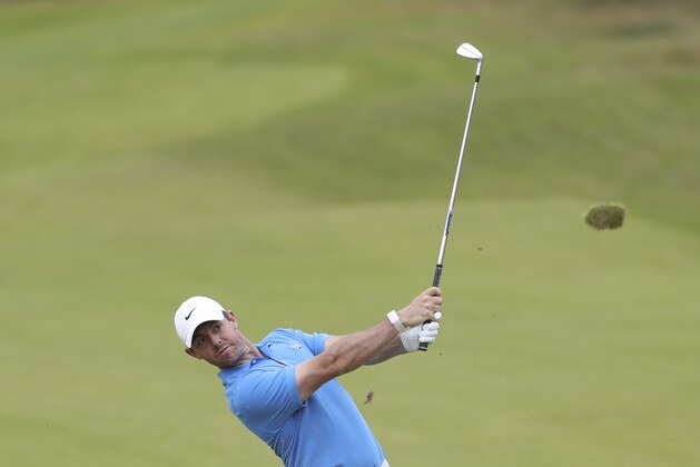 Northern Ireland's Rory McIlroy plays a shot on the 8th fairway during a practice round ahead of the start of the British Open golf championships at Royal Portrush in Northern Ireland, Tuesday, July 16, 2019. The British Open starts Thursday. (AP Photo/Peter Morrison)