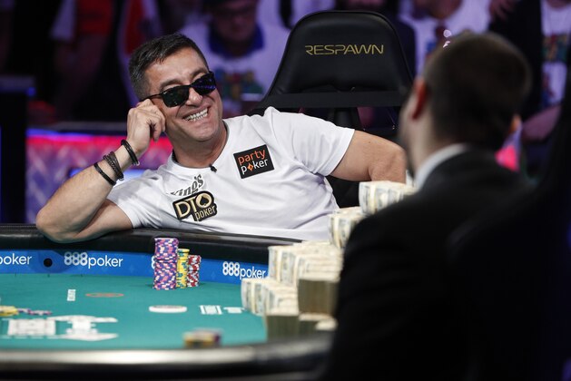 Hossein Ensan, of Germany, reacts after a hand at the final table of the World Series of Poker main event Tuesday, July 16, 2019, in Las Vegas. (AP Photo/John Locher)