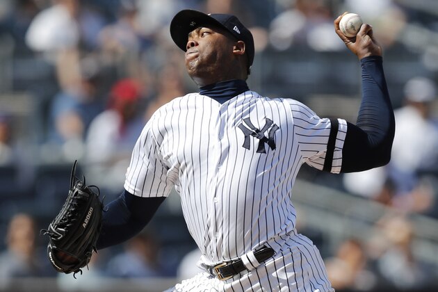 New York Yankees relief pitcher Aroldis Chapman winds up during the ninth inning of a baseball game against the Toronto Blue Jays, Sunday, July 14, 2019, in New York. (AP Photo/Kathy Willens)
