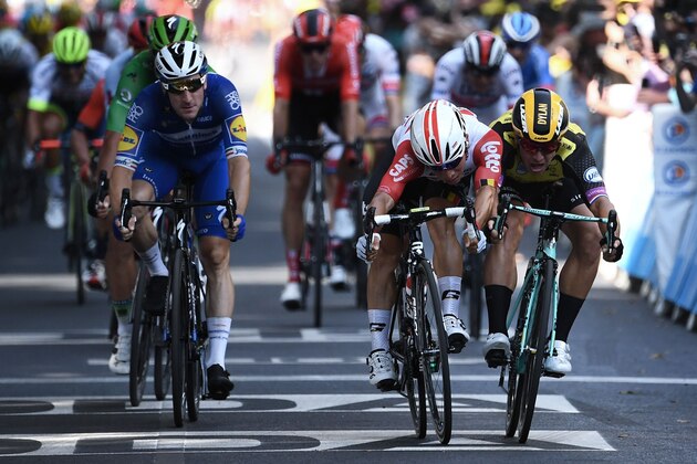 Australia's Caleb Ewan (frontC) wins past Netherlands' Dylan Groenewegen (R) and Italy's Elia Viviani (L) on the finish line of the eleventh stage of the 106th edition of the Tour de France cycling race between Albi and Toulouse, in Toulouse on July 17, 2019. (Photo by Anne-Christine POUJOULAT / AFP)        (Photo credit should read ANNE-CHRISTINE POUJOULAT/AFP/Getty Images)