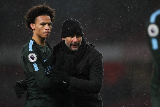 LONDON, ENGLAND - MARCH 01: Leroy Sane of Manchester City and Pep Guardiola the head coach / manager of Manchester City at full time during the Premier League match between Arsenal and Manchester City at Emirates Stadium on March 1, 2018 in London, England. (Photo by Matthew Ashton - AMA/Getty Images)