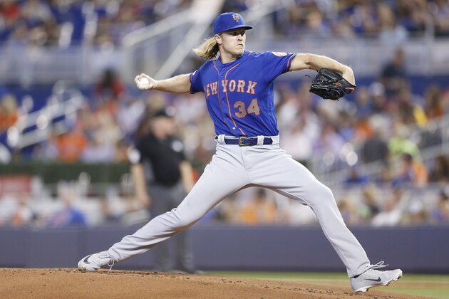MIAMI, FLORIDA - JULY 13:  Noah Syndergaard #34 of the New York Mets delivers a pitch in the first inning against the Miami Marlins at Marlins Park on July 13, 2019 in Miami, Florida. (Photo by Michael Reaves/Getty Images)