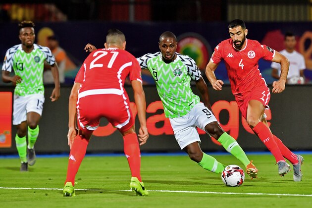 Nigeria's forward Odion Ighalo (2nd-R) dribbles past Tunisia's defender Nassim Hnid during the 2019 Africa Cup of Nations (CAN) third place play-off football match between Tunisia and Nigeria at the Al Salam stadium in Cairo on July 17, 2019. (Photo by Giuseppe CACACE / AFP)        (Photo credit should read GIUSEPPE CACACE/AFP/Getty Images)
