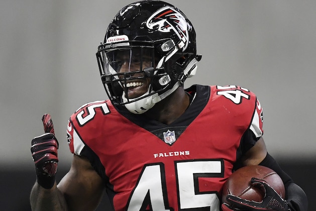 Atlanta Falcons linebacker Deion Jones (45) runs back to the bench after he intercepted the ball and ran it in for a touchdown against the Arizona Cardinals during the first half of an NFL football game, Sunday, Dec. 16, 2018, in Atlanta. (AP Photo/Danny Karnik)