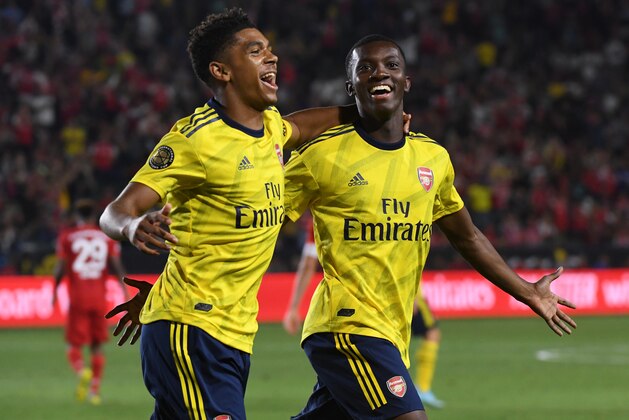 Forward Eddie Nketiah of Arsenal (R) celebrates with teammate Tyreece John-Jules (L) after scoring the winning goal against Bayern Munich during their International Champions Cup football match at the Dignity Health Stadium in Carson, California on July 17, 2019. (Photo by Mark RALSTON / AFP)        (Photo credit should read MARK RALSTON/AFP/Getty Images)
