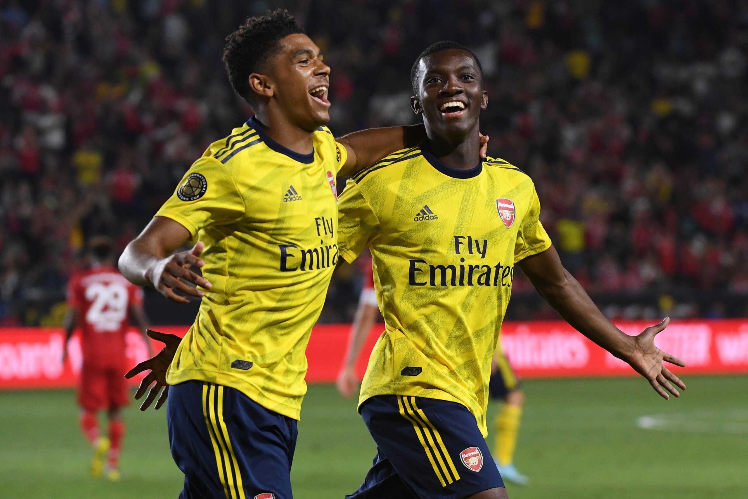 Forward Eddie Nketiah of Arsenal (R) celebrates with teammate Tyreece John-Jules (L) after scoring the winning goal against Bayern Munich during their International Champions Cup football match at the Dignity Health Stadium in Carson, California on July 17, 2019. (Photo by Mark RALSTON / AFP)        (Photo credit should read MARK RALSTON/AFP/Getty Images)