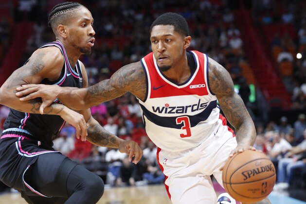 Washington Wizards guard Bradley Beal (3) drives past Miami Heat forward Rodney McGruder during the first half of an NBA basketball game, Saturday, Nov. 10, 2018, in Miami. (AP Photo/Wilfredo Lee)