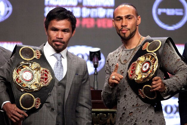 Philippine boxer Manny Pacquiao (L) and US boxer Keith Thurman pose as they hold their final press conference at the MGM Grand Hotel & Casino on July 17, 2019 in Las Vegas, Nevada, ahead of their July 20th WBA welterweight fight. - Keith Thurman vowed to retire Philippine boxing legend Manny Pacquiao as the two fighters traded verbal jabs ahead of the World Boxing Association battle for welterweight supremacy. (Photo by John GURZINSKI / AFP)        (Photo credit should read JOHN GURZINSKI/AFP/Getty Images)