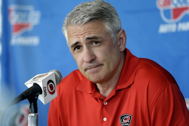 FILE - In this May 5, 2014, file photo, Ron Francis, at the time the general manager of the Carolina Hurricanes, takes questions from members of the media during a news conference in Raleigh, N.C. Seattle’s NHL expansion team is close to an agreement with Francis to become its first general manager, a person with direct knowledge tells The Associated Press. The person spoke on condition of anonymity Tuesday, July 16, 2019, because the team had not made an announcement. The expansion Seattle franchise is set to begin play in the 2021-22 season as the NHL’s 32nd team.(AP Photo/Gerry Broome, File)