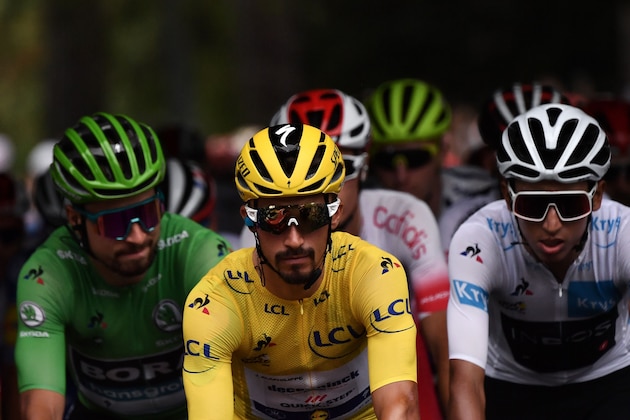 France's Julian Alaphilippe (C), wearing the overall leader's yellow jersey, Slovakia's Peter Sagan (L), wearing the best sprinter's green jersey and Colombia's Egan Bernal, wearing the best young's white jersey ride during the twelfth stage of the 106th edition of the Tour de France cycling race between Toulouse and Bagneres-de-Bigorre, on July 18, 2019. (Photo by Marco Bertorello / AFP)        (Photo credit should read MARCO BERTORELLO/AFP/Getty Images)