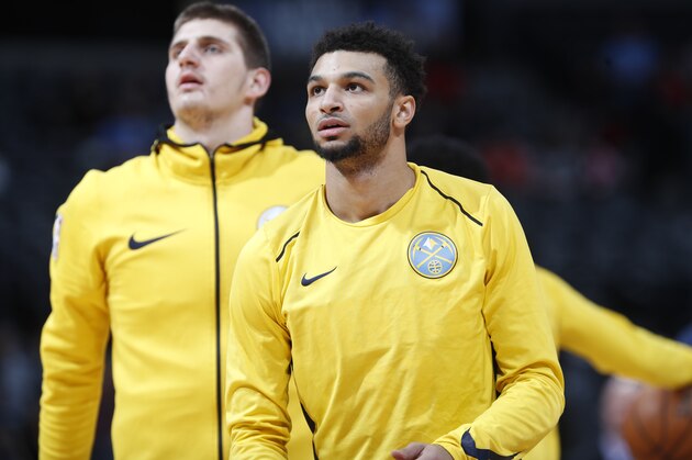 Denver Nuggets guard Jamal Murray (27) and Denver Nuggets center Nikola Jokic (15) in the first half of an NBA basketball game Friday, Jan. 5, 2018, in Denver. (AP Photo/David Zalubowski)
