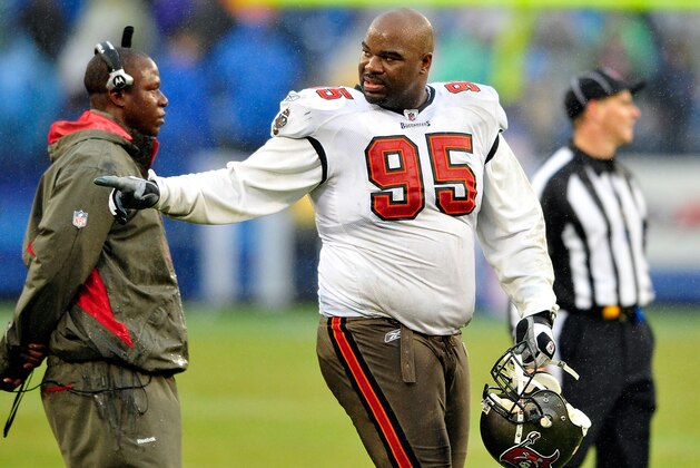 NASHVILLE, TN - NOVEMBER 27: Albert Haynesworth #95 and coach Raheem Morris of the Tampa Bay Buccaneers in action against the Tennessee Titans during play at LP Field on November 27, 2011 in Nashville, Tennessee. The Titans won 23-17. (Photo by Grant Halverson/Getty Images)