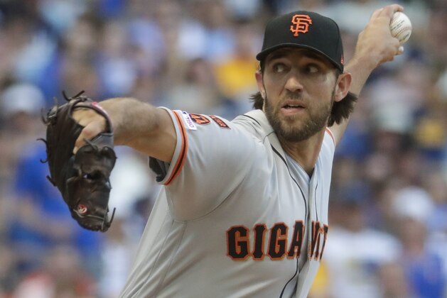 San Francisco Giants starting pitcher Madison Bumgarner throws during the first inning of a baseball game against the Milwaukee Brewers Saturday, July 13, 2019, in Milwaukee. (AP Photo/Morry Gash)