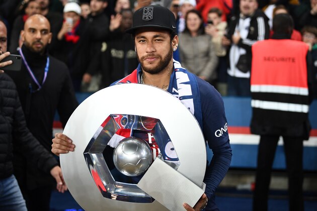 Paris Saint-Germain's Brazilian forward Neymar celebrates with the champion's trophy at the end of the French L1 football match between Paris Saint-Germain (PSG) and Dijon at the Parc des Princes stadium in Paris on May 18, 2019. (Photo by FRANCK FIFE / AFP)        (Photo credit should read FRANCK FIFE/AFP/Getty Images)