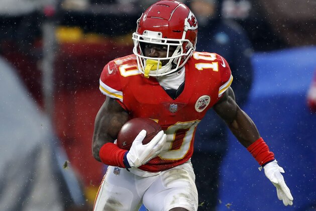 Kansas City Chiefs wide receiver Tyreek Hill (10) carries the ball during the first half of an NFL divisional football playoff game against the Indianapolis Colts in Kansas City, Mo., Saturday, Jan. 12, 2019. (AP Photo/Charlie Neibergall)