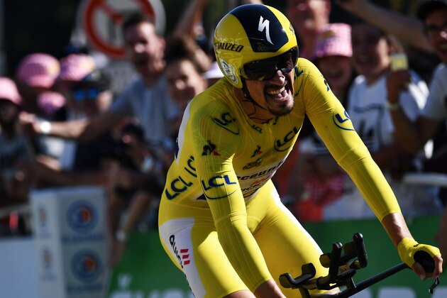 France's Julian Alaphilippe, wearing the overall leader's yellow jersey reacts as he crosses the finish line of the thirteenth stage of the 106th edition of the Tour de France cycling race, a 27,2-kilometer individual time-trial in Pau, on July 19, 2019. (Photo by JEFF PACHOUD / AFP)        (Photo credit should read JEFF PACHOUD/AFP/Getty Images)