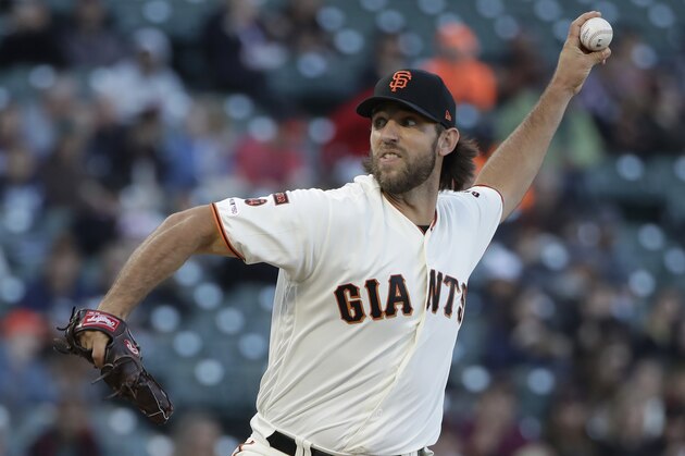 San Francisco Giants pitcher Madison Bumgarner throws to a Colorado Rockies batter during the first inning of a baseball game in San Francisco, Tuesday, June 25, 2019. (AP Photo/Jeff Chiu)