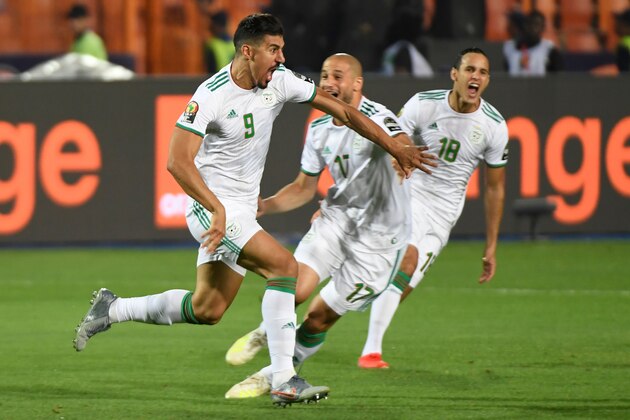 Algeria's forward Baghdad Bounedjah (L) celebrates his goal during the 2019 Africa Cup of Nations (CAN) Final football match between Senegal and Algeria at the Cairo International Stadium in Cairo on July 19, 2019. (Photo by Khaled DESOUKI / AFP)        (Photo credit should read KHALED DESOUKI/AFP/Getty Images)
